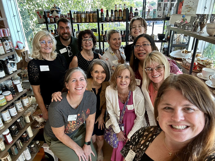 Women's networking group posing together during a private event at Olive 'n Vinnie's in Glen Ellyn