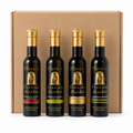 Four Olive 'n Vinnie's olive oils and balsamics in front of a kraft shipping box, Feast gift box