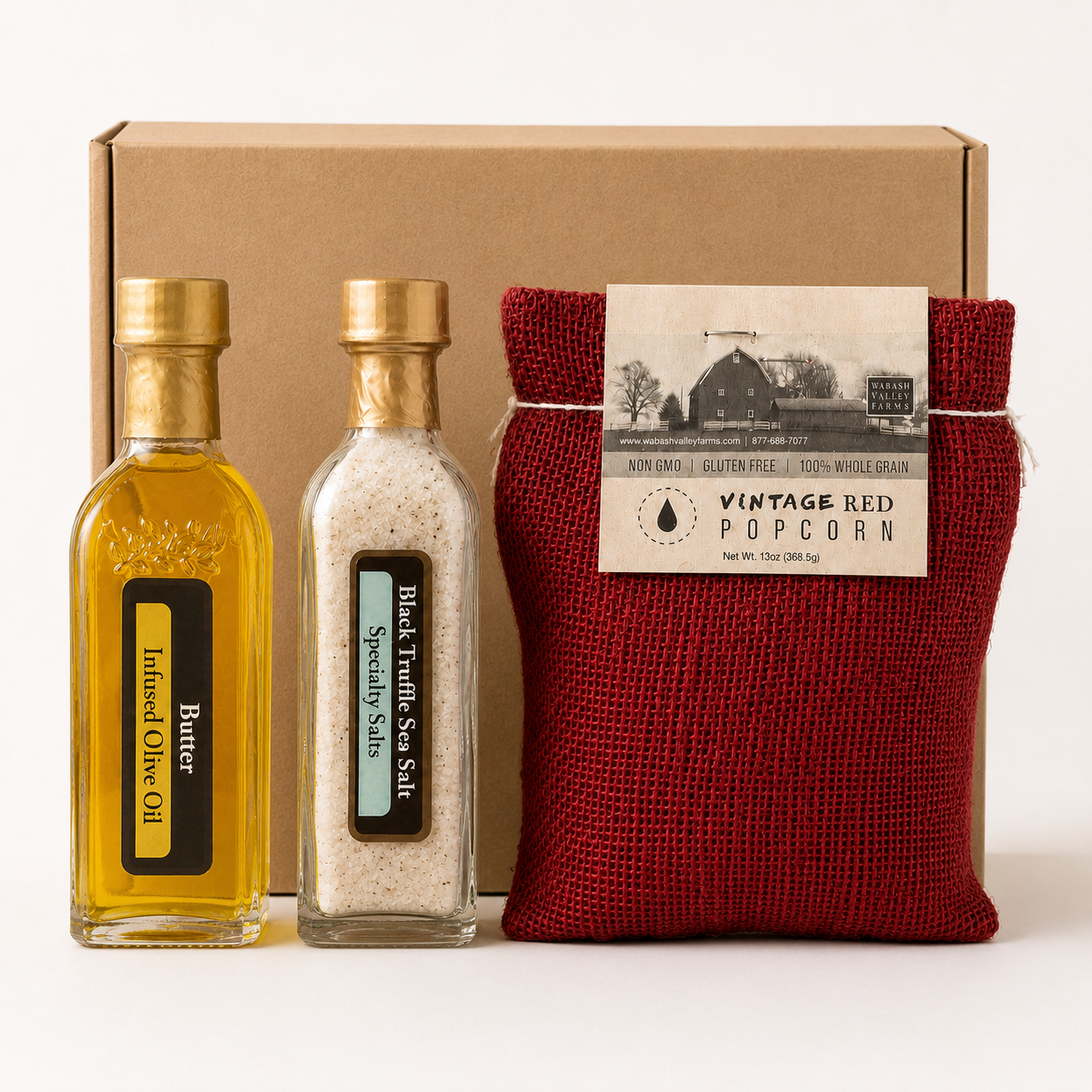 Olive 'n Vinnie's butter olive oil, truffle sea salt, and popcorn in front of a kraft shipping box, Movie Night gift box