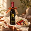 Olive ‘n Vinnie’s Denissimo 25-year balsamic tied with a copper ribbon, with strawberries and parmesan