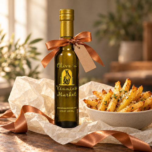 Olive ‘n Vinnie’s White Truffle Oil tied with a copper ribbon, with a bowl of fries