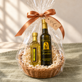 Gift basket with a full-size Olive ‘n Vinnie’s olive oil and a mini bottle, wrapped in cellophane with a copper bow